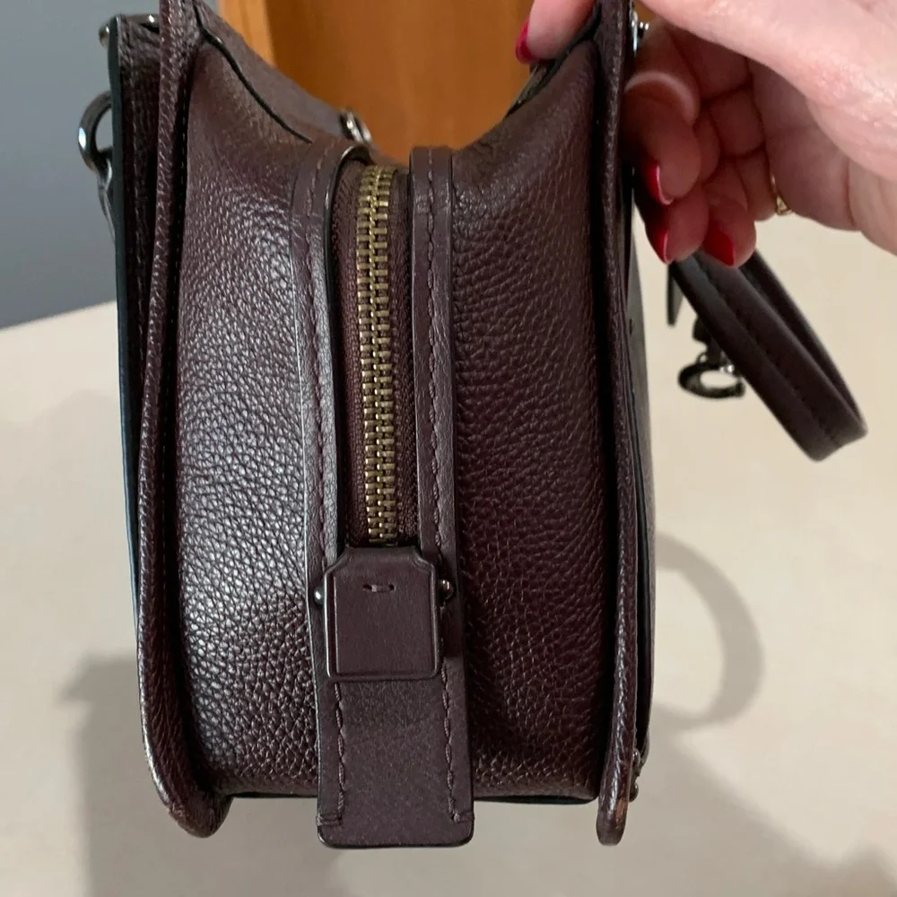 Coach Leather Handbag with shoulder straps. Plum in color